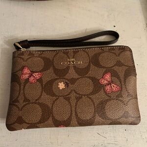 Coach Brown Wristlet with Pink Butterfly Accents